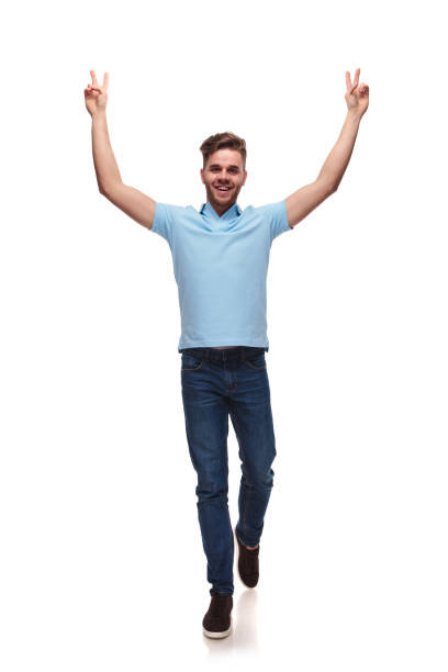 istock young casual man steps forward while celebrating with victory sign 1091244116