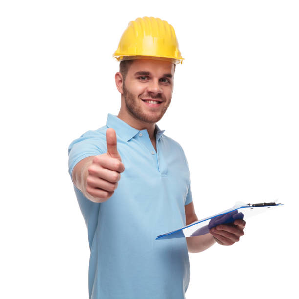 istock handsome engineer makes thumbs up sign while holding blue files 1091245504