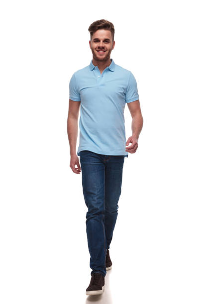 istock attractive casual man wearing blue polo t-shirt steps forward 1091245742