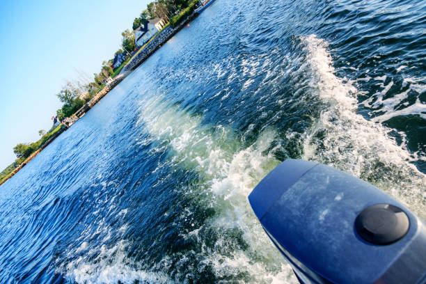 istock Turbulent Waves and Wake Spreading Behind Speeding Outboard Motor Boat 1091247472