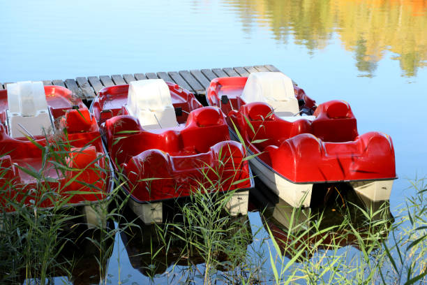 istock Red floating pedal bicycle boats 1091250426