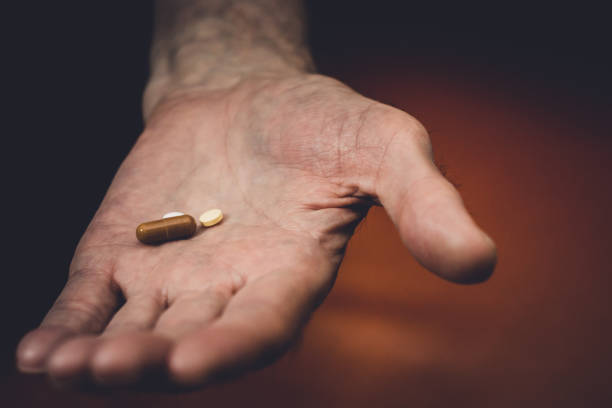 istock pills in the old hand 1091257854