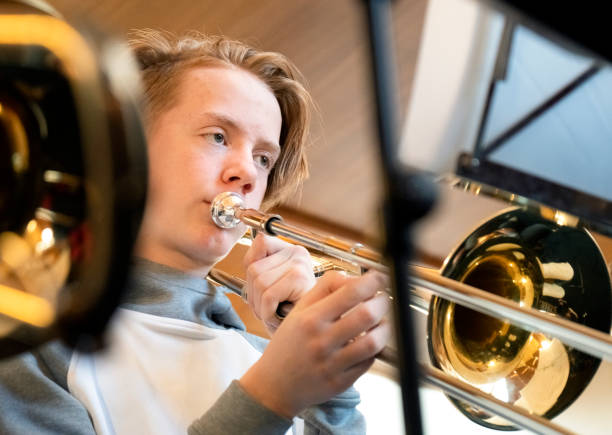 istock Young teenager playing the trombone 1091258168