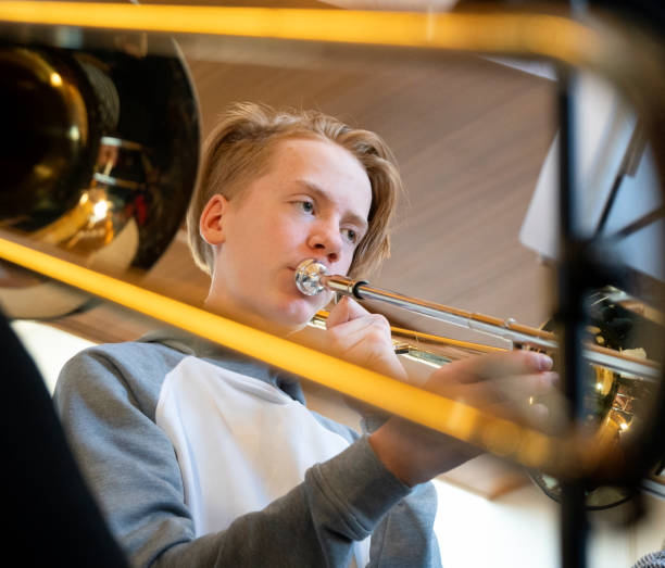 istock Boy playing the trombone at concert 1091258176