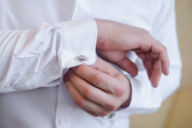 istock Men's hands fasten cuff links 1091269648