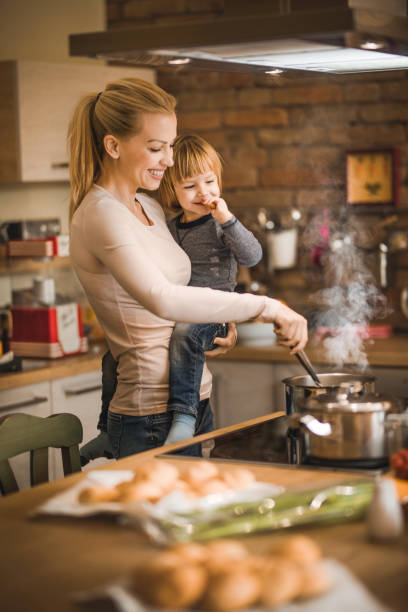 istock Loving mother and son cooking lunch in the kitchen. 1091298966