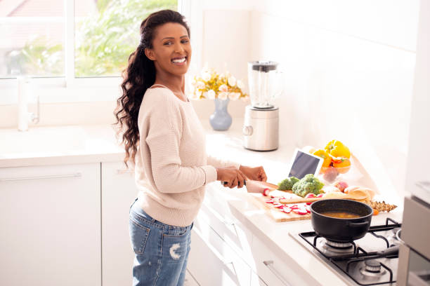istock Woman preparing healthy vegetarian soup. 1091299176