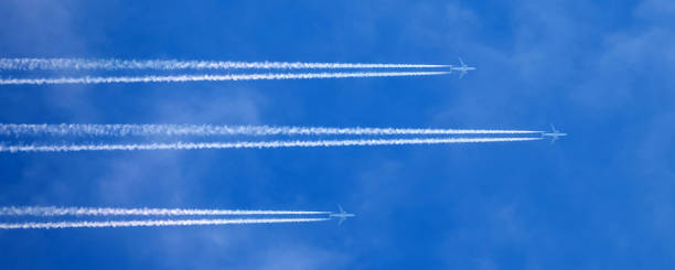 istock huge passenger planes fly high in the sky one behind another 1091307494