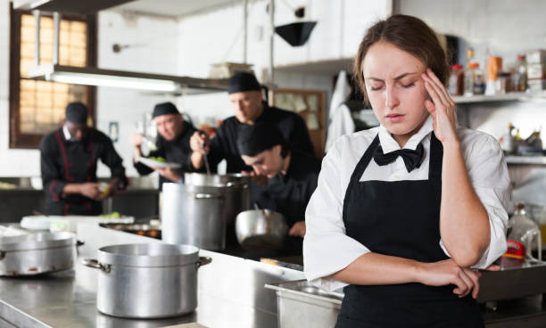 istock Tired and upset waitress in kitchen of restaurant 1091309350