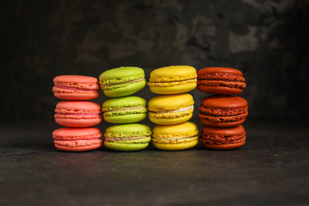 istock macaron or macaroon cake, colorful cookies (dark background). copy space 1091309478