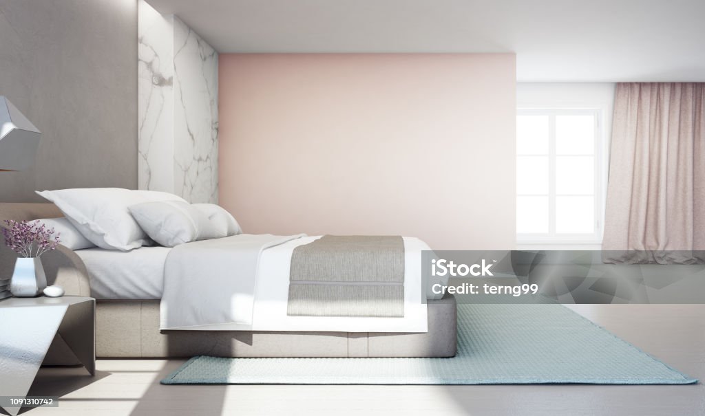 Bedroom of luxury house with double bed and carpet on wooden floor. Empty pink concrete wall background in vacation home or holiday villa. 3d rendering of hotel interior. Pastel Colored Stock Photo Bedroom of luxury house with double bed and carpet on wooden floor. Empty pink concrete wall background in vacation home or holiday villa. 3d rendering of hotel interior. Pastel Colored Stock Photo