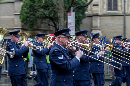 Melbourne, Australia - April 25, 2015: A military marching band playing trumpets at the ANZAC Day parade.