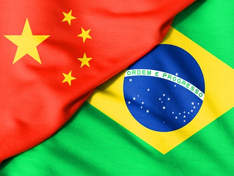 Two flags. Flag of China. Flag of Brazil.