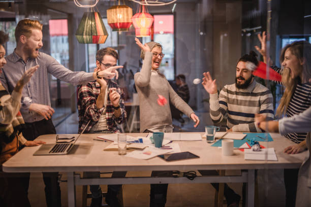 istock Large group of playful creative people having fun at casual office. 1091313164