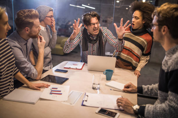 istock Furious boss shouting at his team on a meeting in the office. 1091315200