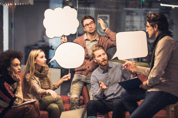 istock Young entrepreneurs with speech bubbles having a meeting with their manager. 1091317632