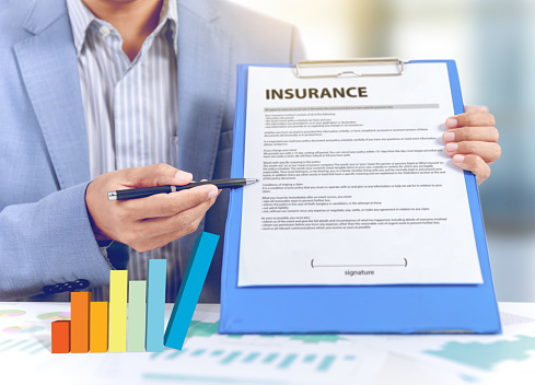 Businessman present insurance paper document plan