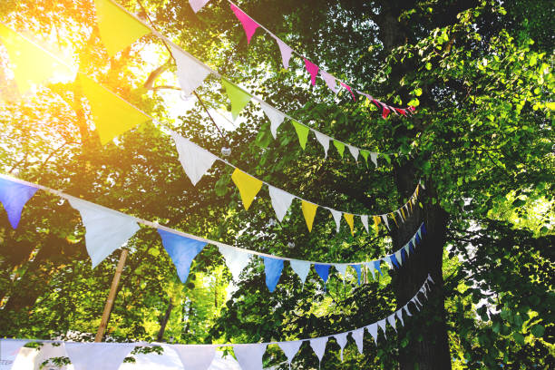 istock festival ribbons and flags fluttering downwind, toned 1091328990