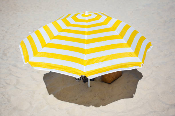 istock big bright beach umbrella in the sand 1091329174