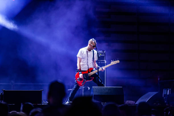 istock Rock Guitarist Playing Electric Guitar on Stage 1091329794