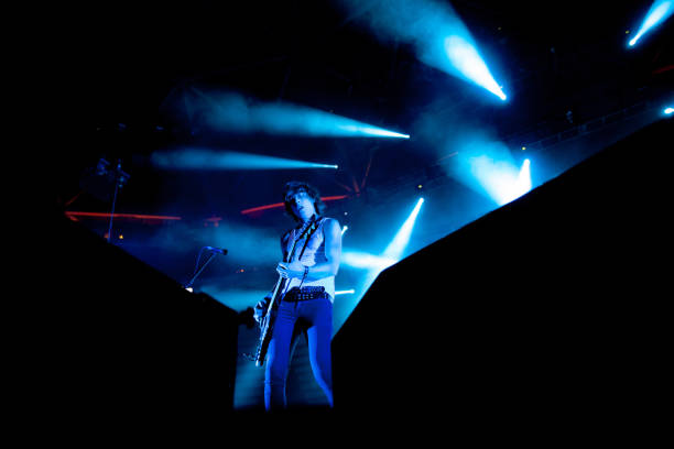 Rock Performer Playing Electric Guitar on Stage.