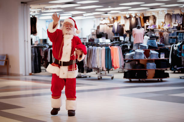 shopping christmas with family and santa claus at shopping mall - ipad shopping gift retail imagens e fotografias de stock