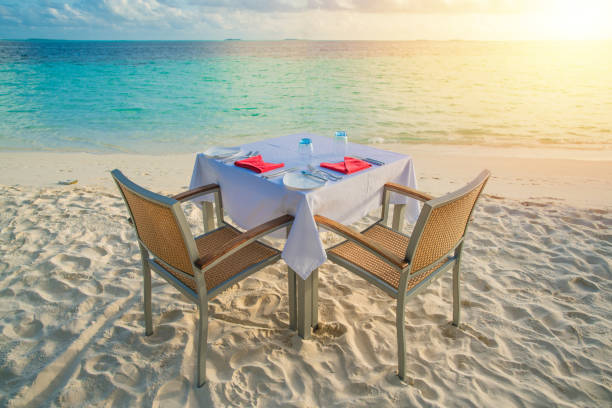 istock Table outdoor next to sea scenic prepare for special romantic dinner time with sunlight shading 1091335870