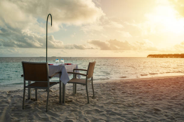 istock Table outdoor next to sea scenic prepare for special romantic dinner time with sunlight shading 1091335886