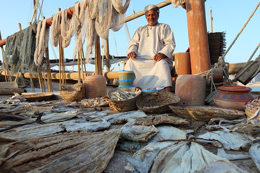 Omani fisherman selling his products During the Dhow festival at Katara beach.