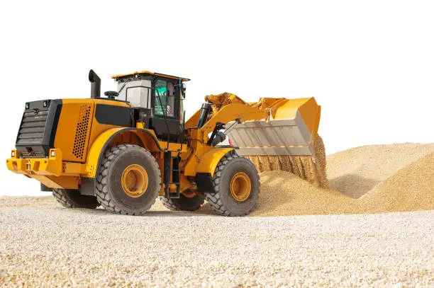 Working bulldozer on a building site isolated with clipping path. Modern wheel Loader Isolated.