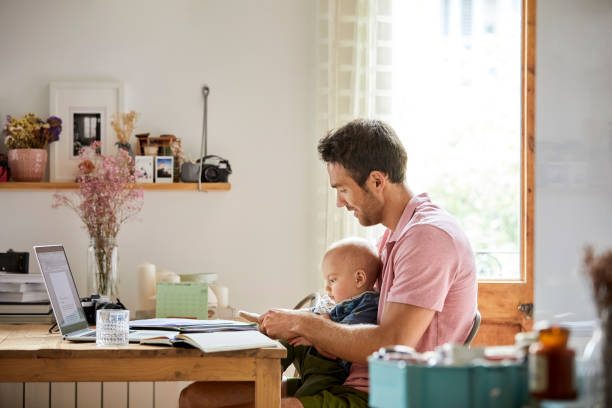 istock Mid adult man with son analyzing documents at home 1091346006