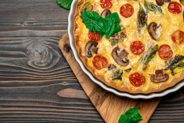 istock Baked homemade quiche pie in ceramic baking form 1091347440