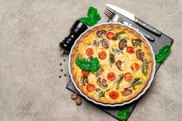 istock Baked homemade quiche pie in ceramic baking form 1091347452