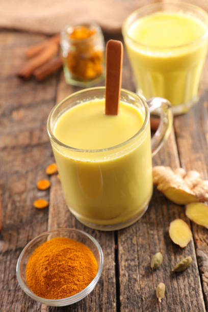 istock golden milk on wood background 1091349014