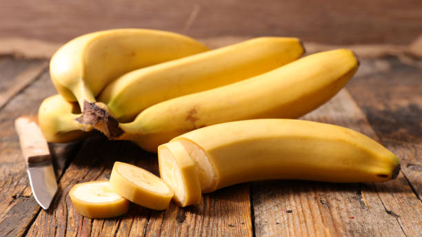 istock banana on wood background 1091349680
