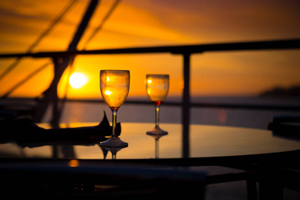 istock Wine glasses on balcony overlooking at sunset 1091349772