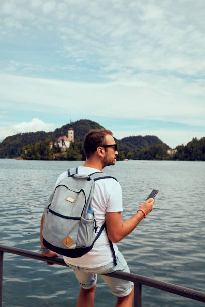 istock Modern guy using cellphone in the European city. 1091354520
