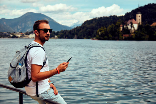 istock Modern guy using cellphone in the European city. 1091354906