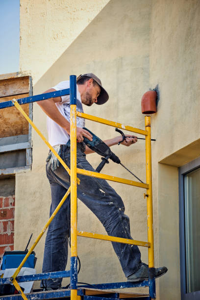 istock Builder at the finish house working with the tool. 1091354926