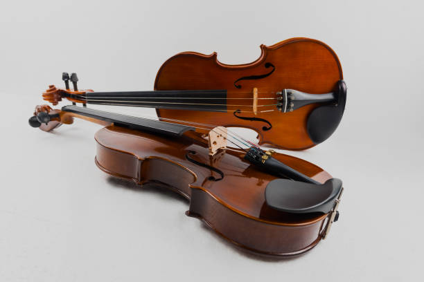 istock Violin and viola put on white background,During the practice break time to prepare For the concert. 1091357344