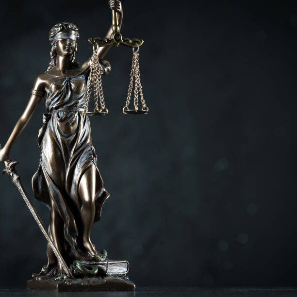 istock Law and Justice symbols on dark background 1091358344