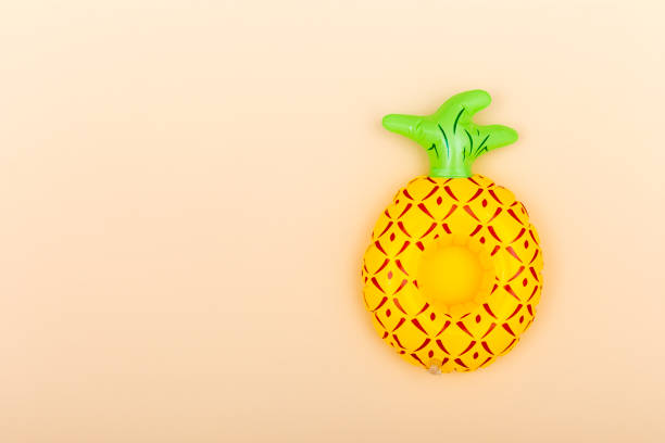 Inflatable cup holder on an orange background with copy space