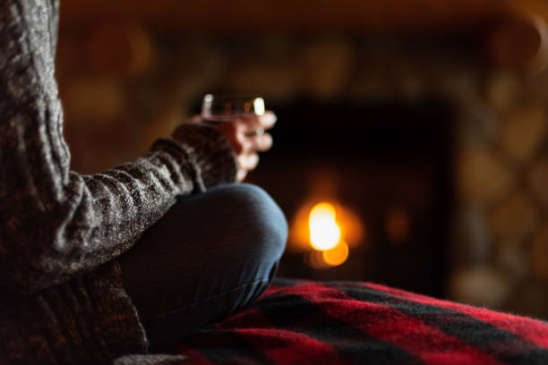 glass of wine in cozy cabin - rustic bedroom cabin indoors imagens e fotografias de stock