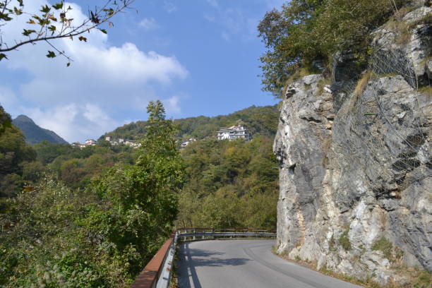 istock Panoramic view to a road alongh mountain rocks in a sunny summer day. 1091375580