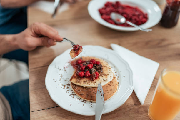 istock Eating delicious homemade pancakes. 1091383694