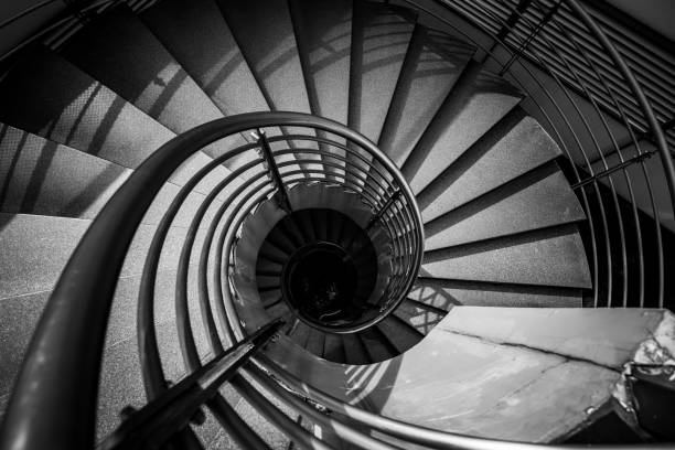 Abstract detail of a spiral staircase in black and white colour Abstract detail of a spiral staircase in black and white colour hypnosis circle stock pictures, royalty-free photos & images