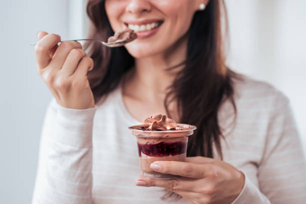 istock Eating chocolate creme dessert, close-up. 1091386332