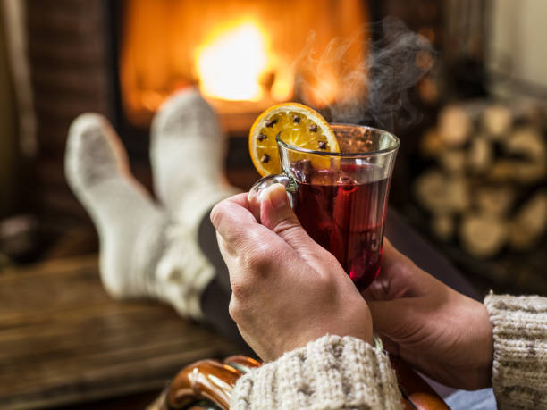 istock Hot mulled wine and book in woman hands. 1091391414