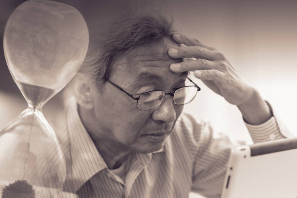 istock Elder with Alzheimer loss time memory disease concept. 1091394692