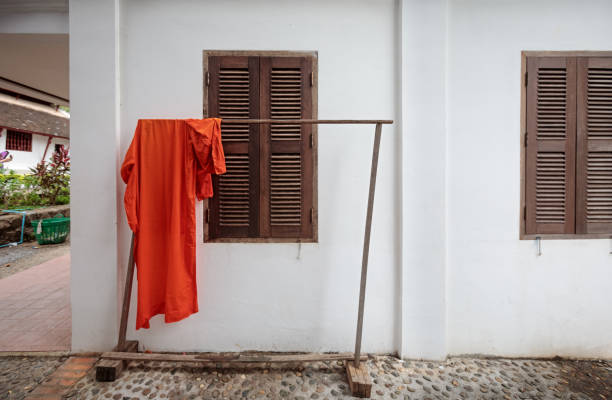 Monks robe put out to dry outside a temple in a street in Luang Prabang, the former capital of Laos